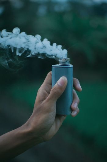 Close-up of hand holding vape