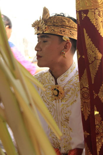 Youth wearing traditional balinese clothes modified during traditional ceremonies