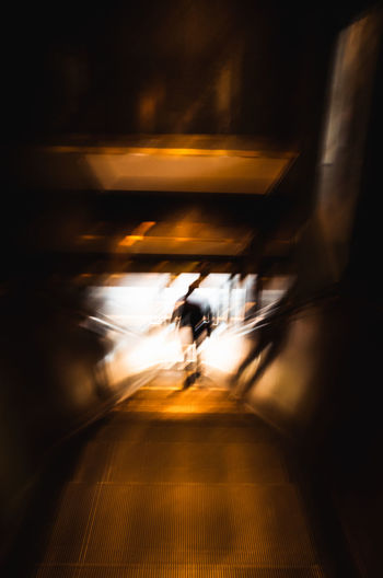 Blurred motion of man walking in train