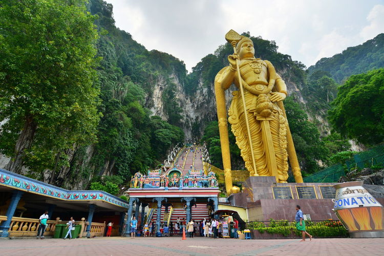 Gold statue of lord murugan at batu caves