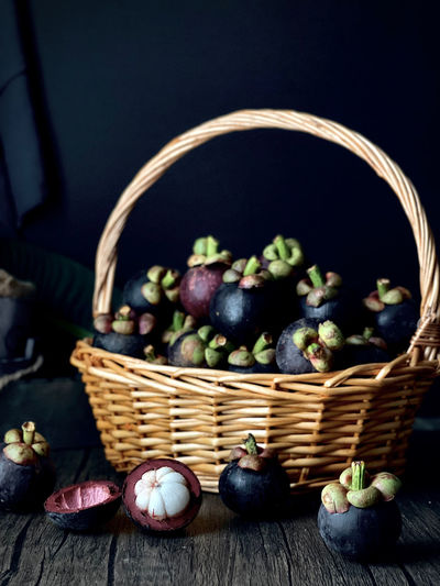 Close-up of fruits in basket on table