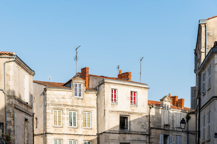 Decadent old residential buildings in the historic centre of la rochelle, france
