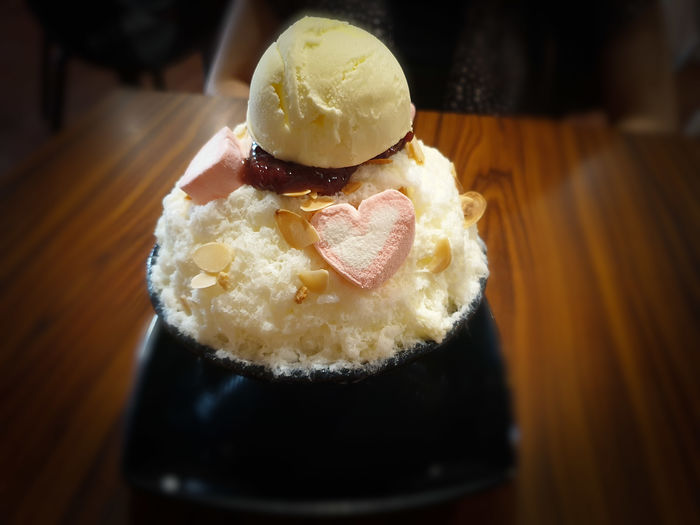 Close-up of ice cream served on table