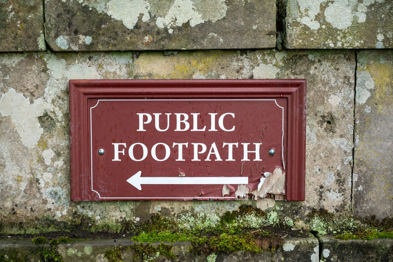Close-up of sign on wall
