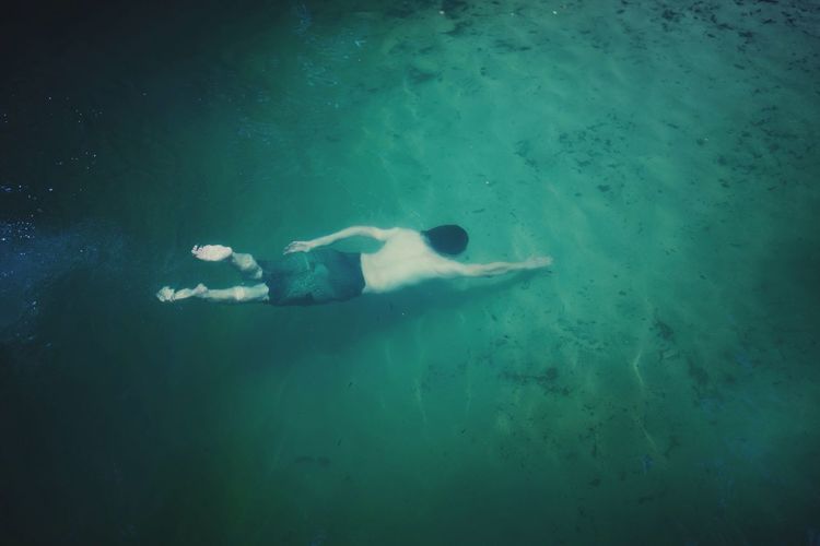 Man swimming in sea
