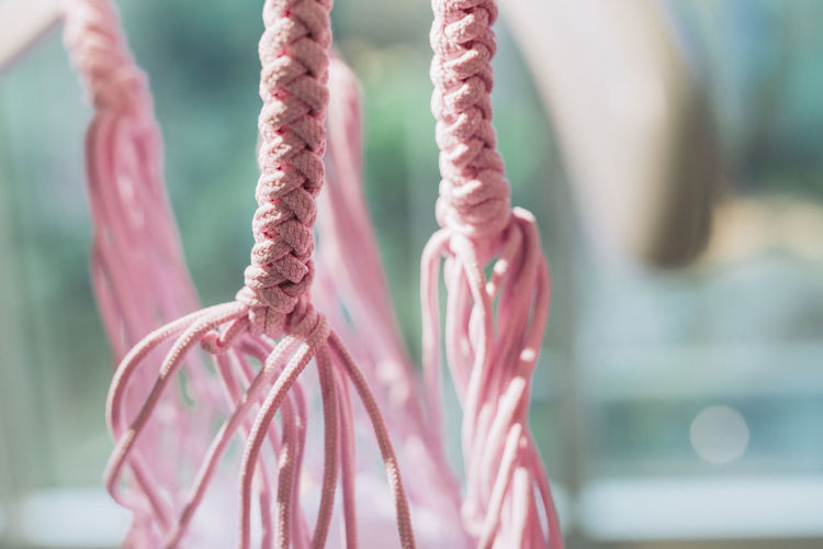 Close-up of pink decoration hanging outdoors