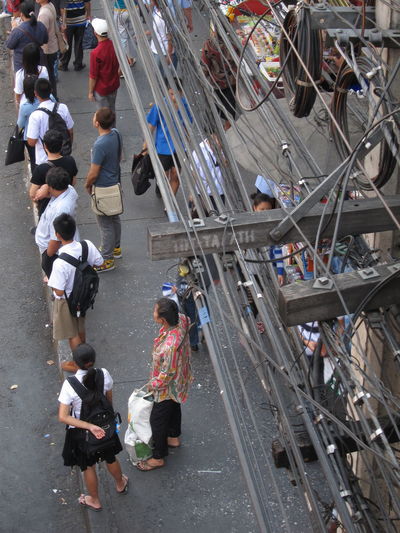 High angle view of people standing on sidewalk