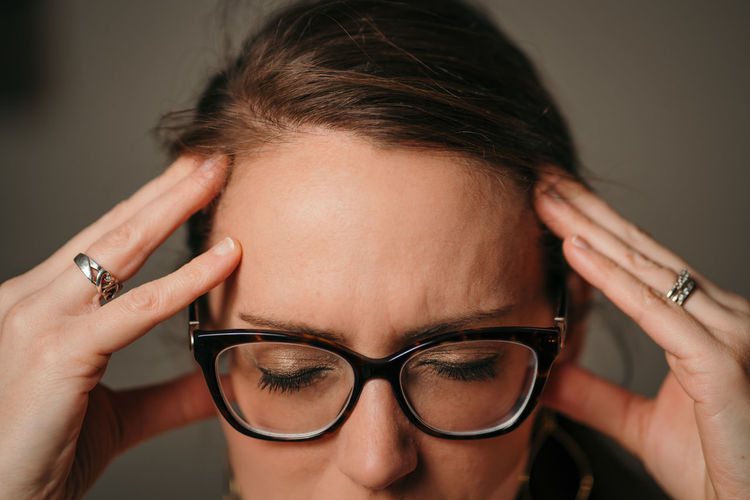 Close-up portrait of woman wearing eyeglasses