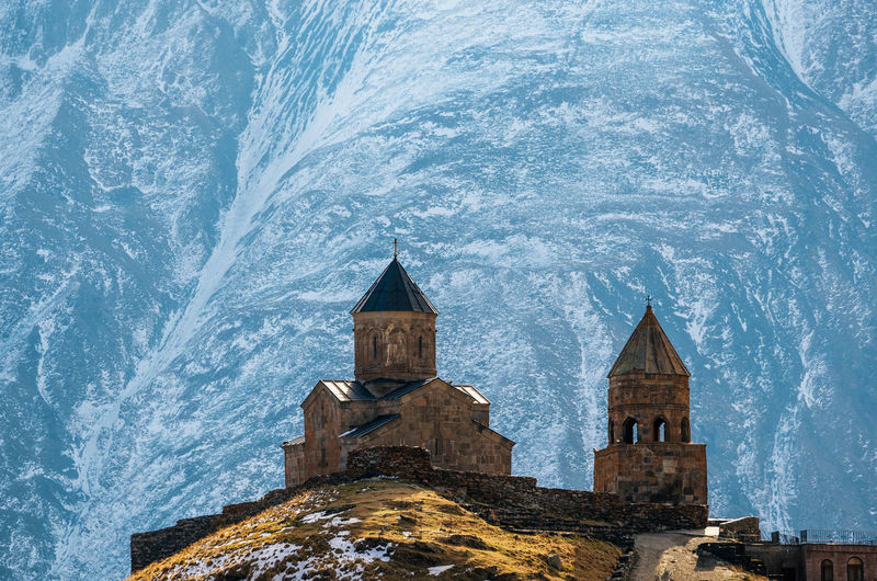 Church against snow covered mountains