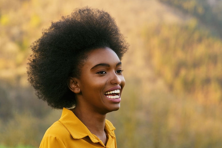 Afro american woman smiling happy in nature