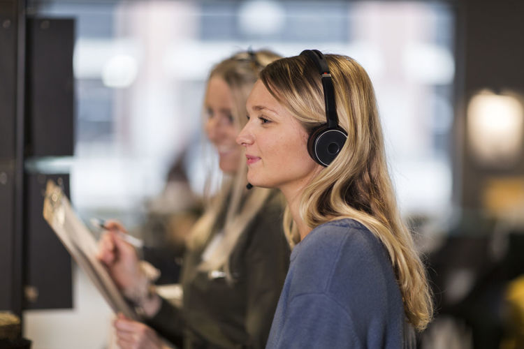 Woman wearing headset in office