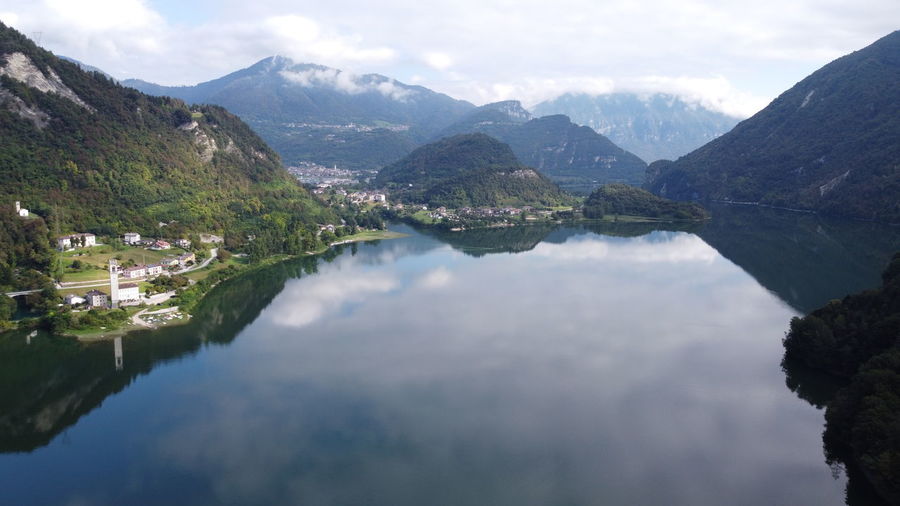 Scenic view of mountains and lake against sky in lago di corlo belluno. dji mavic mini top