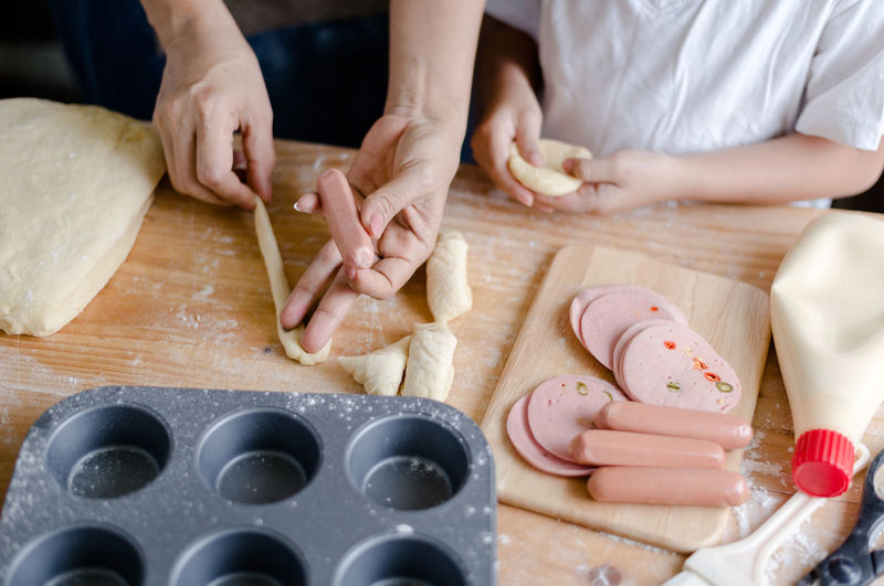 Cropped hands of woman preparing food