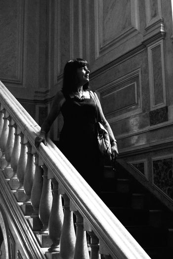 Low angle view of woman standing on steps