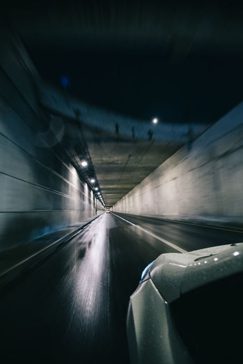 Car moving on road in tunnel