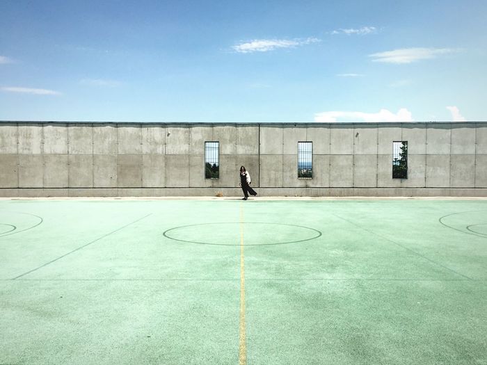 Woman standing in playing field