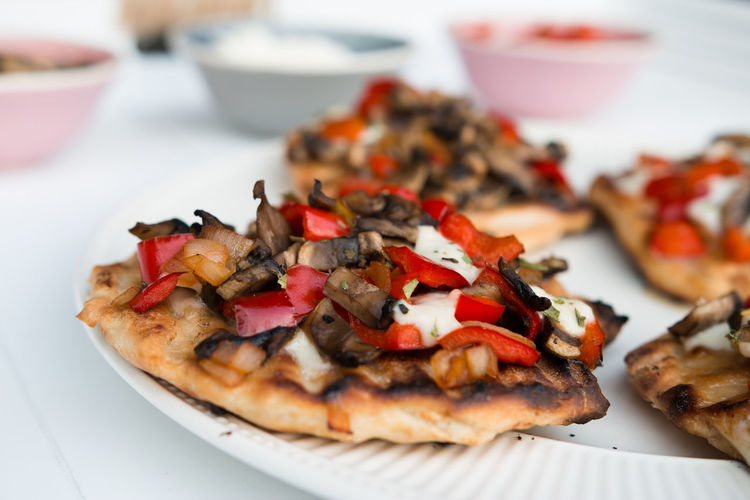 Close-up of pizzas in plate on table
