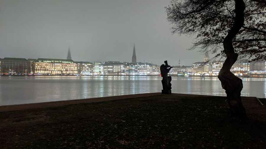 View of man standing at riverbank