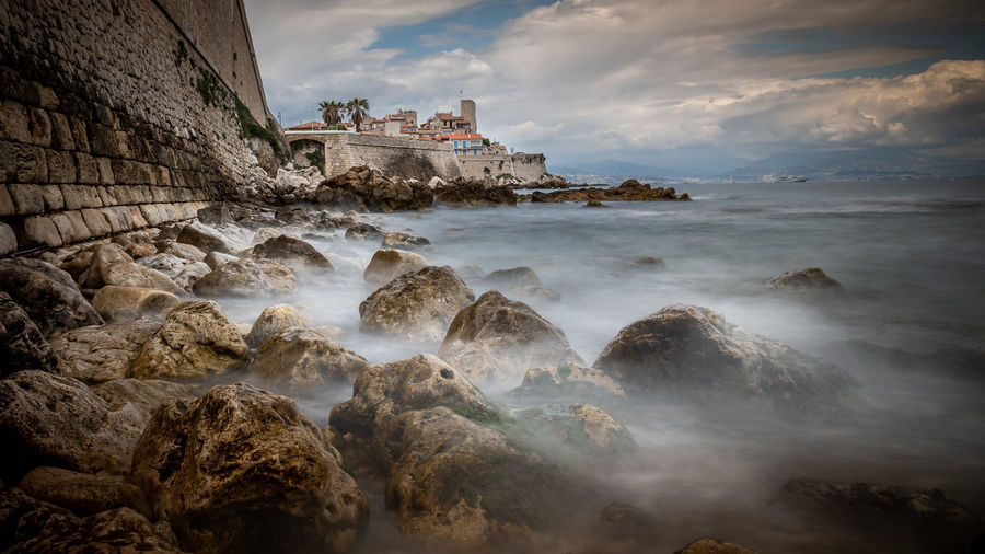 Scenic view of sea against cloudy sky