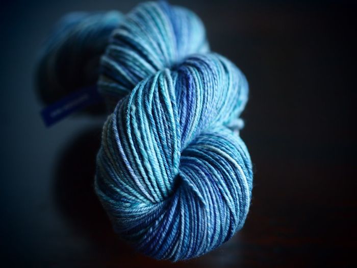 Close-up of blue fabric against black background