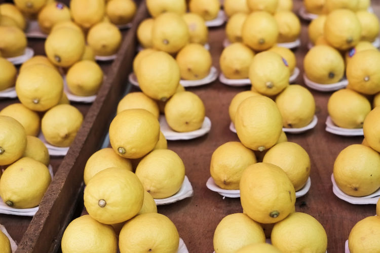 Full frame shot of lemon fruits for sale at market stall
