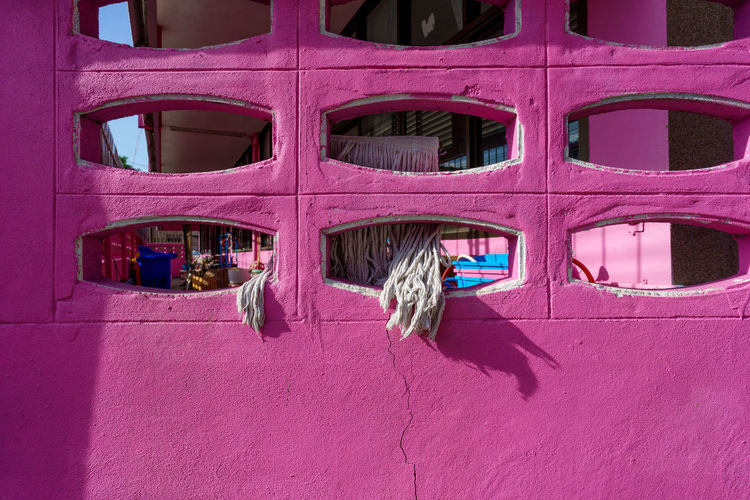 Full frame shot of pink window on building