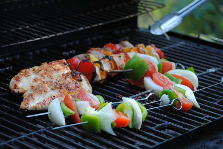 Close-up of food in skewers on barbecue grill