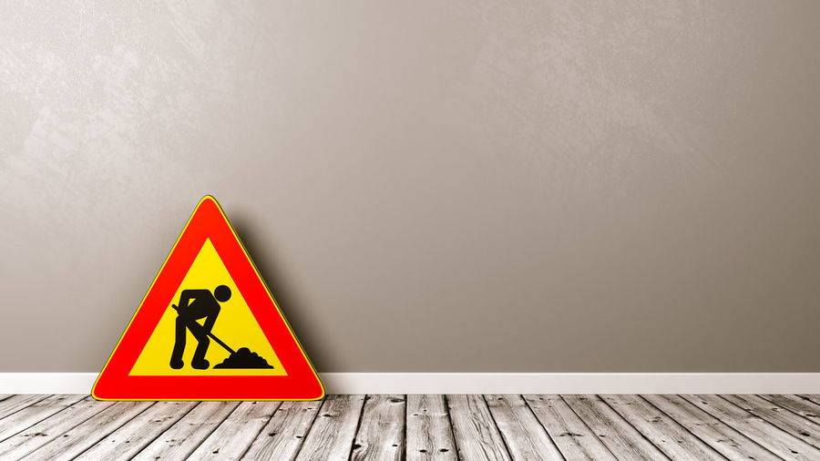 Warning sign on wall
