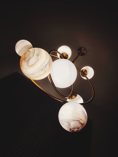 High angle view of light bulb hanging on table