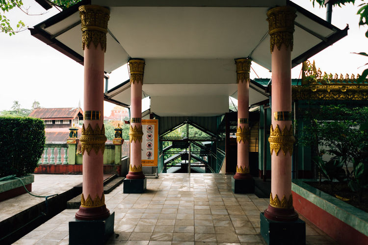 Corridor of temple against sky