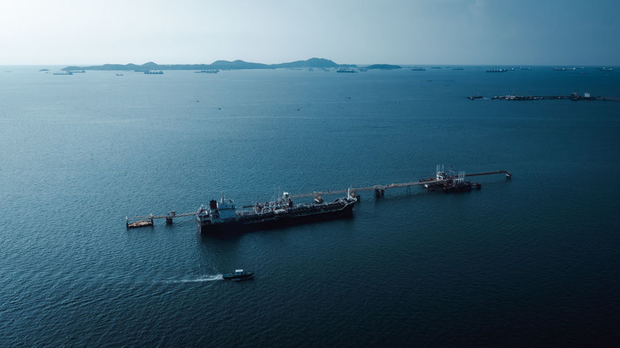 High angle view of shipping oil loading terminal bridge on the sea dramatic 