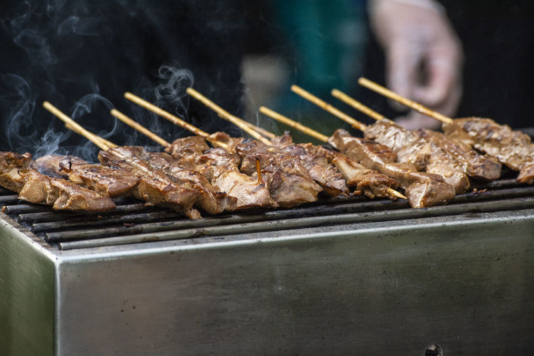 Close-up of meat on barbecue grill