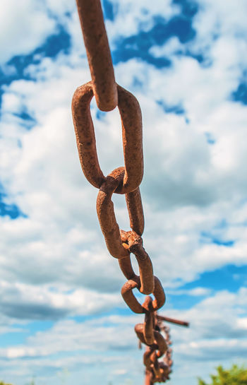 Close-up of chain against sky