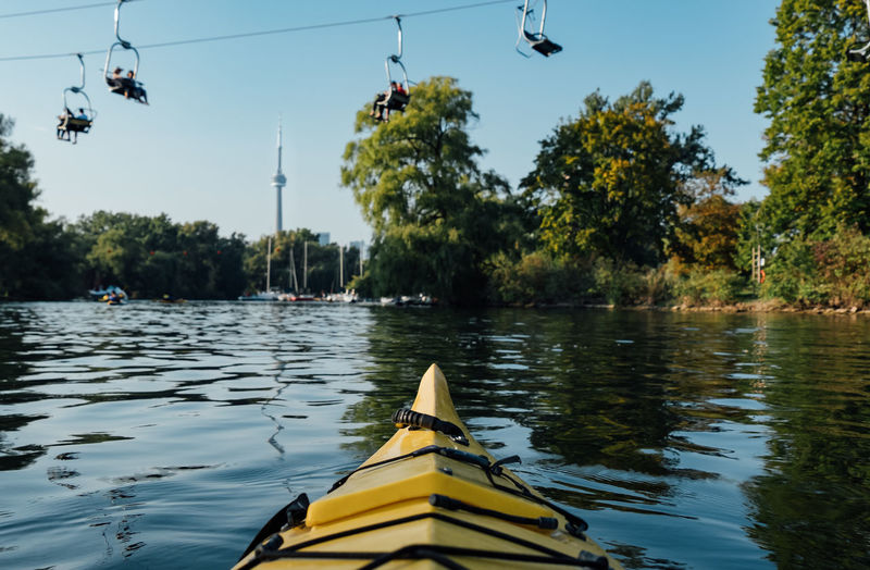 Kayak in lake against trees