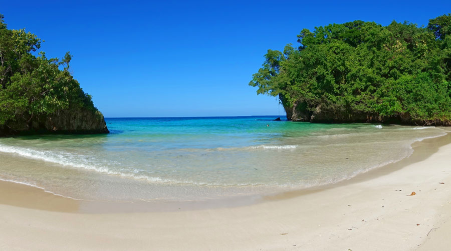 Scenic view of sea against clear blue sky