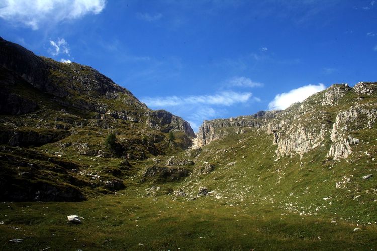 Scenic view of dolomites mountain range against sky