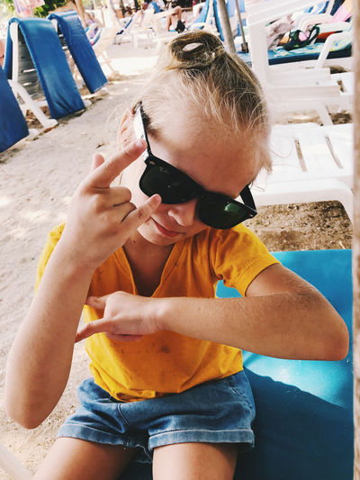 Midsection of boy with sunglasses