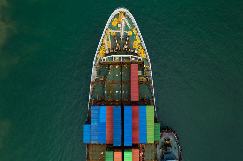 High angle view shipping containers transportation sailing on the sea 