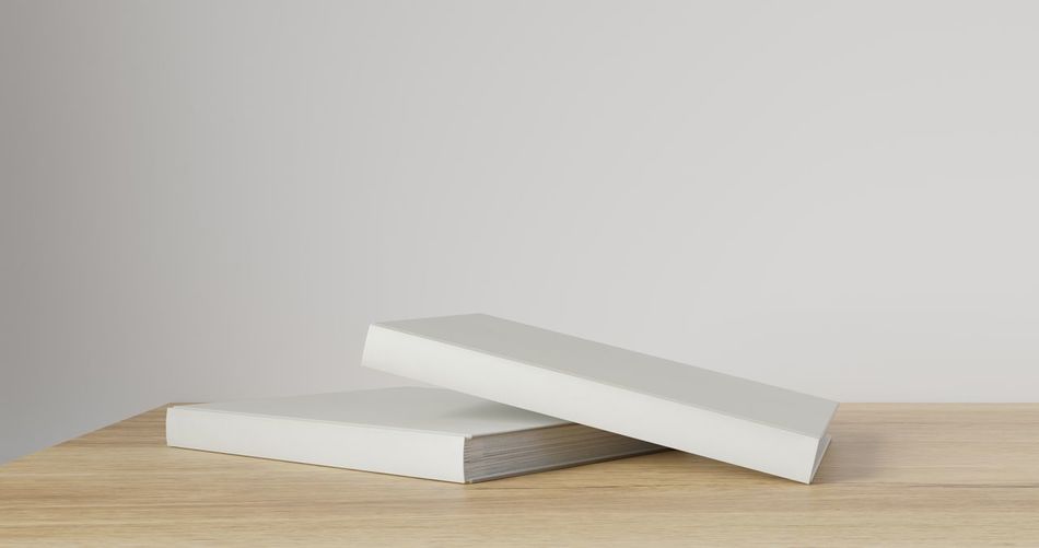 White paper on table against wall