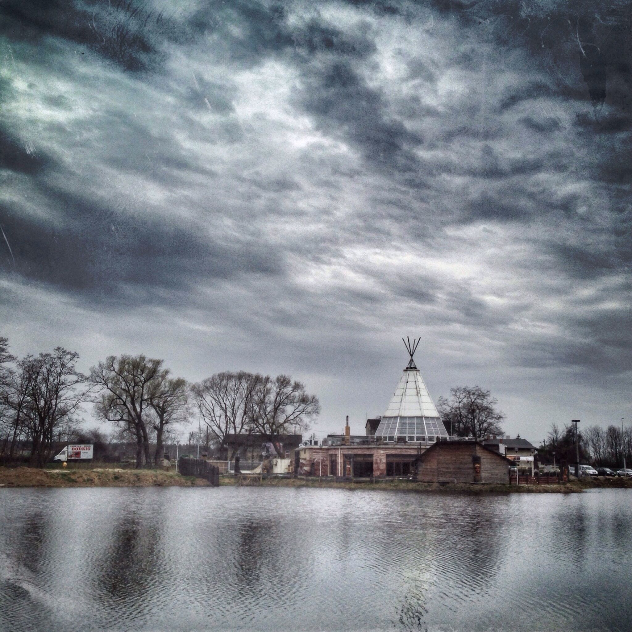 architecture, built structure, building exterior, sky, cloud - sky, water, cloudy, waterfront, religion, place of worship, spirituality, church, tree, cloud, reflection, weather, lake, overcast