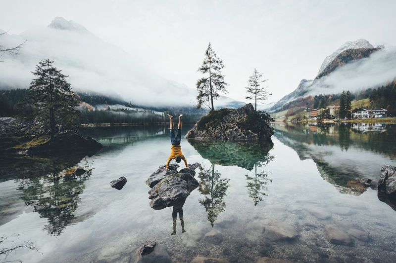 Athletic in the mountains Bavaria Alps Water Lake Beauty In Nature Mountain Nature Reflection Real People Scenics Lifestyles Sky Leisure Activity Tranquility Outdoors Tranquil Scene Rear View Day Standing Men Tree Fresh On Market 2016