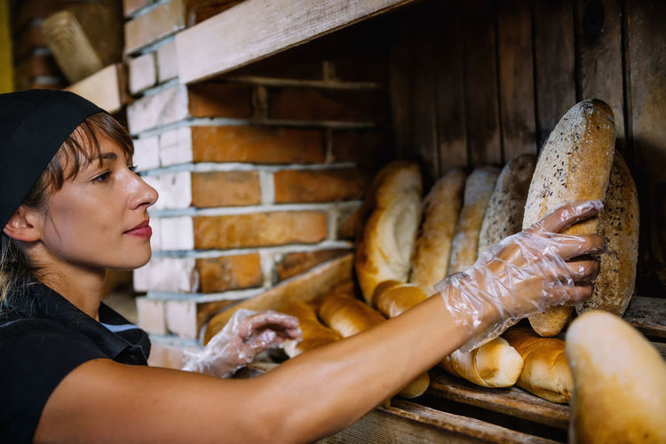 Young woman working at bakery
