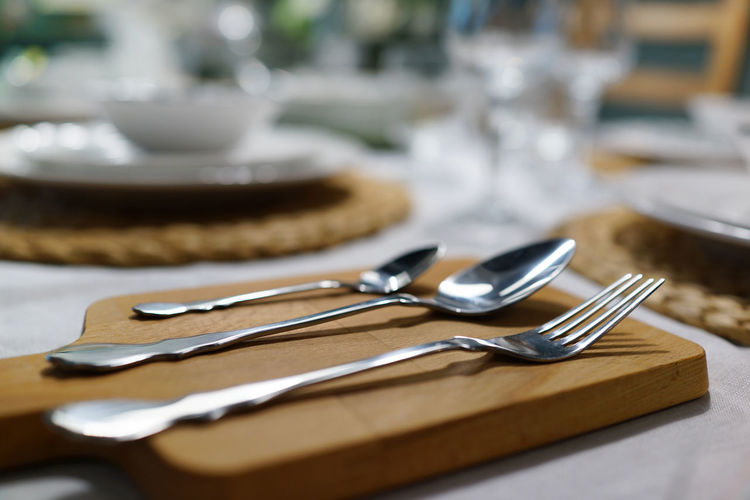 Close-up of eating utensils on table at restaurant