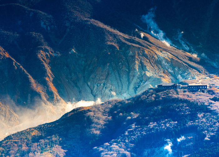 View from peak of kintokiyama of owakudani where  sulfur gases are escaping in hakone, japan.