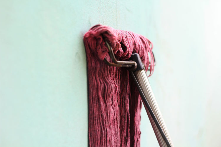 Close-up of mop on wall