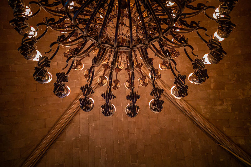 Low angle view of chandelier hanging on ceiling