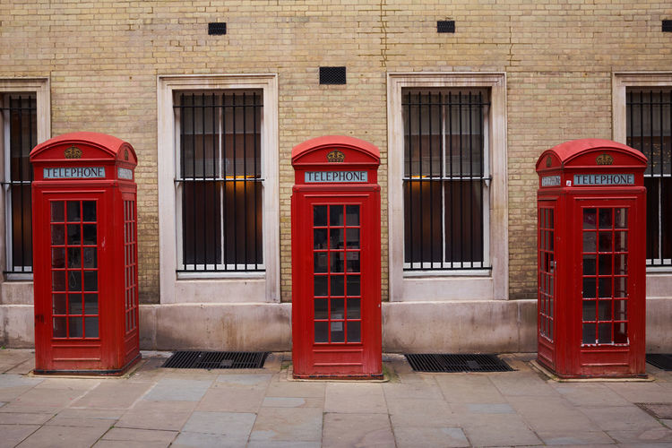 Three red booths on a row in broad court, covent garden, london, uk.
