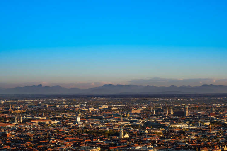 Munich panorama view with alps mountains in the evening light