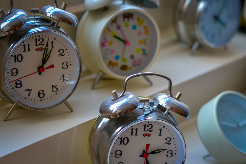 Close-up of alarm clocks on display at store