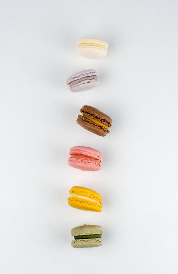 High angle view of candies against white background